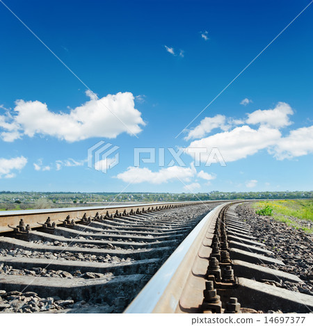 railroad to horizon under blue cloudy sky railroad to horizon under blue cloudy sky 14697377