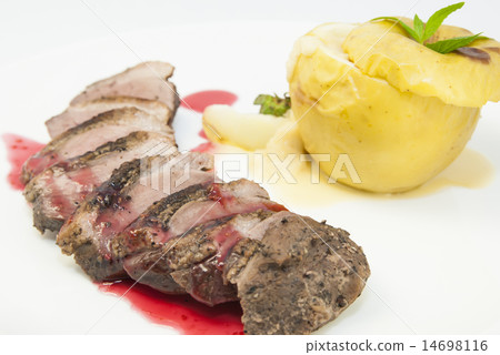 roast goose breast with apple sauce on white plate 14698116