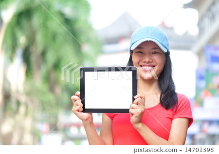 young asian woman hold blank digital tablet young asian woman hold blank digital tablet 14701398