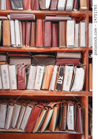 Paper documents stacked in archive Paper documents stacked in archive 14701765