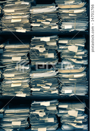 Paper documents stacked in archive 14701766