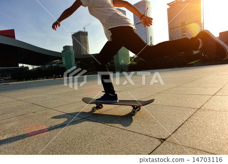 woman skateboarder legs skateboarding at sunrise c woman skateboarder legs skateboarding at sunrise c 14703116