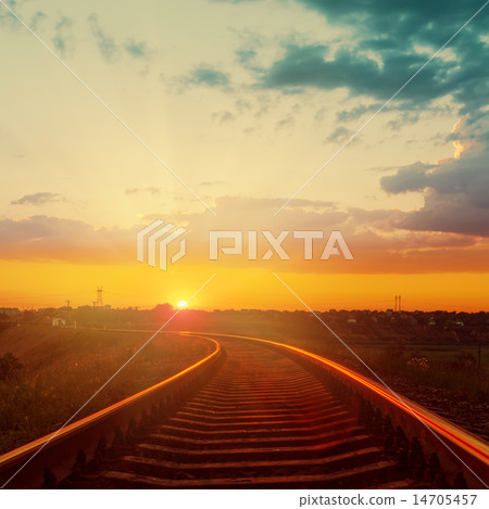 good orange sunset over railroad to horizon good orange sunset over railroad to horizon 14705457
