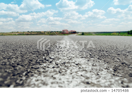 white line on asphalt road close up 14705486