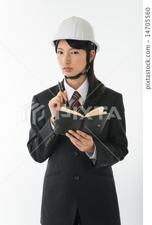 A woman wearing a helmet and wearing a mens suit A woman wearing a helmet and wearing a mens suit 14705560