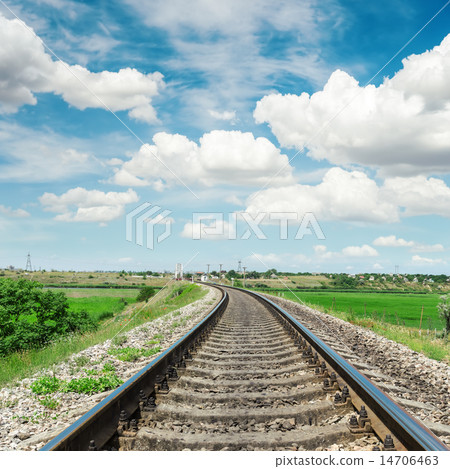 railroad to horizon in green landscape and clouds 14706463