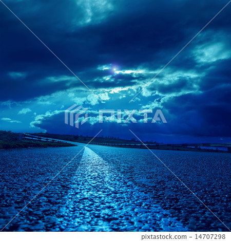 low dramatic clouds over asphalt road in moonlight low dramatic clouds over asphalt road in moonlight 14707298