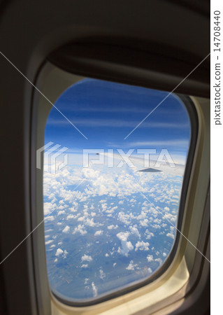 aerial view of blue sky from window of jet flight 14708440