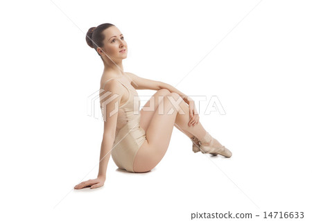 young pretty ballet dancer sitting in elegant pose. back view 14716633