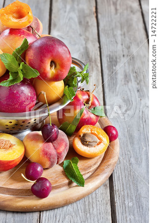 Apricots, nectarines and saturn peaches background 14722221