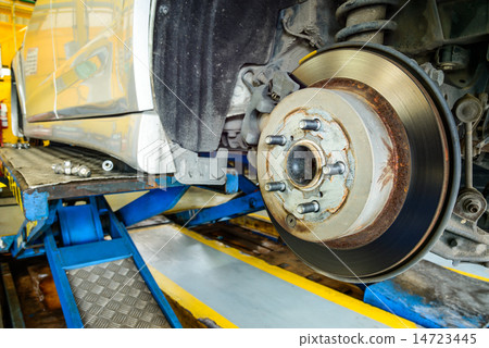 Close up of disk brake on car in process  14723445