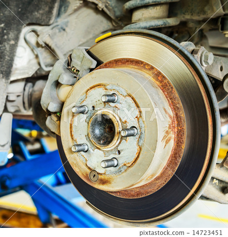 Close up of disk brake on car in process Close up of disk brake on car in process 14723451