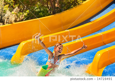 Child in bikini sliding water park. 14728491