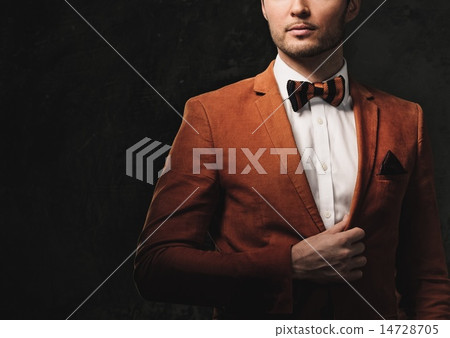 Sharp dressed fashionist wearing jacket and bow tie Sharp dressed fashionist wearing jacket and bow tie 14728705