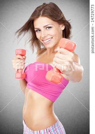 Beautiful slim woman with dumbbells Beautiful slim woman with dumbbells 14729773