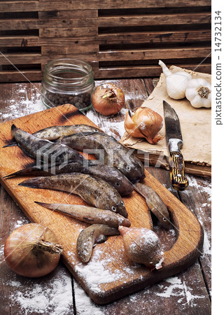 raw fish on the table cooks raw fish on the table cooks 14732134