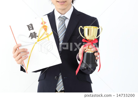 A hand of a businessman with a trophy and catalog 14733200