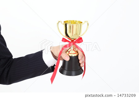 Hand of a businessman with a trophy 14733209