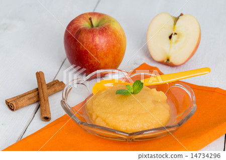 Applesauce with cinnamon and orange spoon 14734296