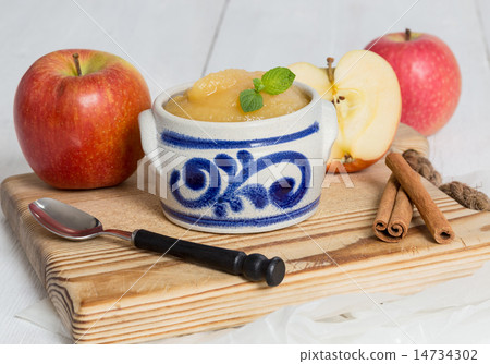 Applesauce with cinnamon in stoneware bowl 14734302