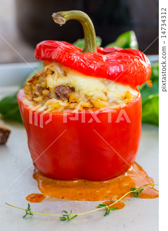 Baked stuffed peppers with meat sauce and cheese 14734312