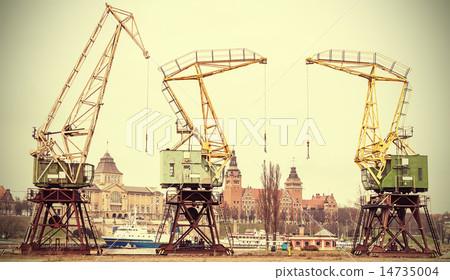 Retro stylized picture of cranes in Szczecin City. 14735004