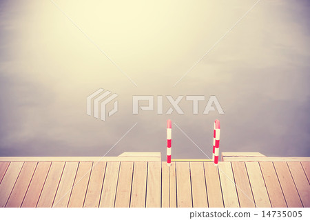 Retro vintage filtered wooden pier and ladder. 14735005