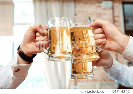 Three glasses of beer in focus Three glasses of beer in focus 14744242
