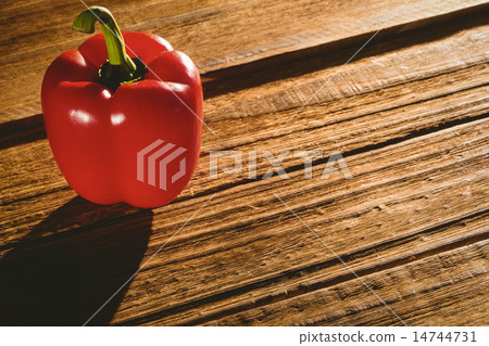 Red pepper on chopping board 14744731