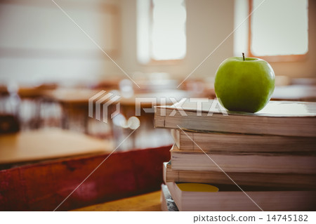 Apple on pile of books 14745182