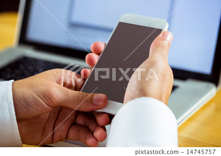 Man using laptop and smartphone 14745757