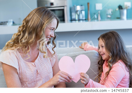 Happy mother and daughter on the couch 14745837