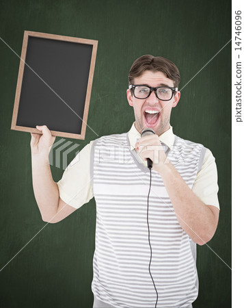 Composite image of geeky hipster holding blackboard and singing 14746096