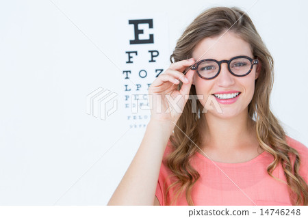Pretty geeky hipster with glasses and eye test 14746248