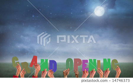 Composite image of hands holding up grand opening Composite image of hands holding up grand opening 14746373