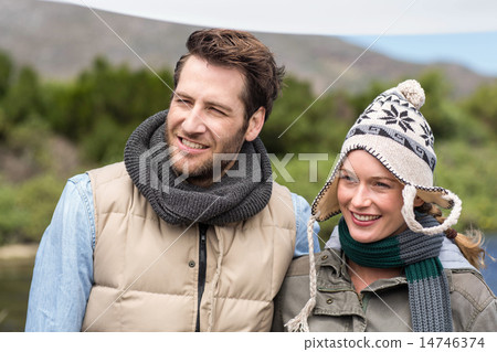 Happy casual couple at a lake Happy casual couple at a lake 14746374