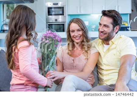 Daughter surprising mother with flowers Daughter surprising mother with flowers 14746442