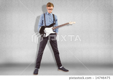Composite image of geeky hipster playing the guitar Composite image of geeky hipster playing the guitar 14746475