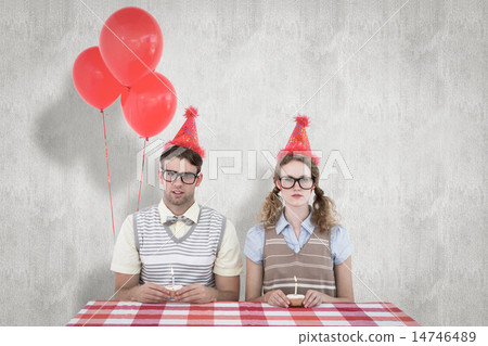 Composite image of geeky hipster couple celebrating his birthday 14746489