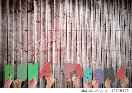 Composite image of hands holding up bona pasqua Composite image of hands holding up bona pasqua 14746505