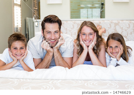Happy family smiling at camera 14746629