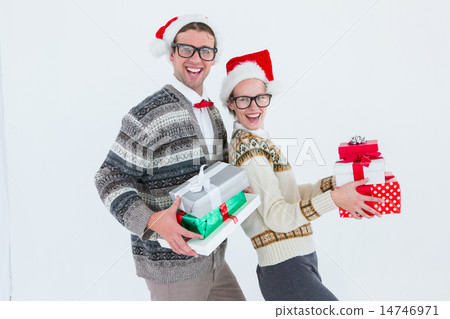 Geeky hipster couple holding presents Geeky hipster couple holding presents 14746971