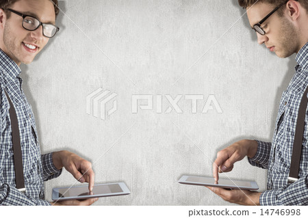Composite image of nerd with tablet pc Composite image of nerd with tablet pc 14746998