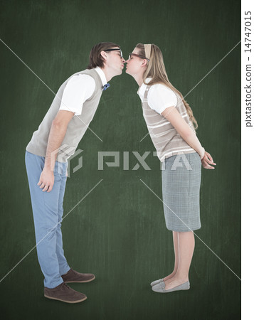 Composite image of geeky hipster couple kissing 14747015