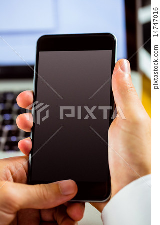 Man using laptop and smartphone 14747016