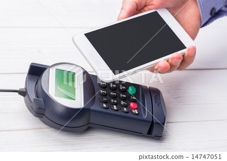 Man using smartphone to express pay Man using smartphone to express pay 14747051