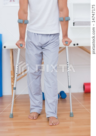 Patient standing with crutch 14747175