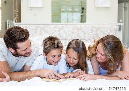 Happy family smiling at camera 14747233
