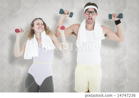 Composite image of geeky hipster couple lifting dumbbells in spo 14747236
