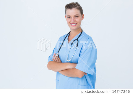 Happy nurse looking at camera with arms crossed 14747246